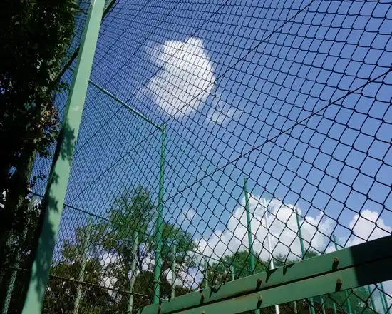 Protective PVC-coated mesh ideal for outdoor fencing.